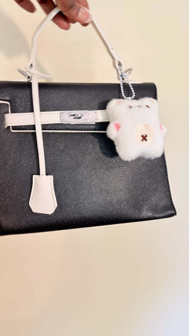 Black and White Structured Top-Handle Bag with Plush Charm